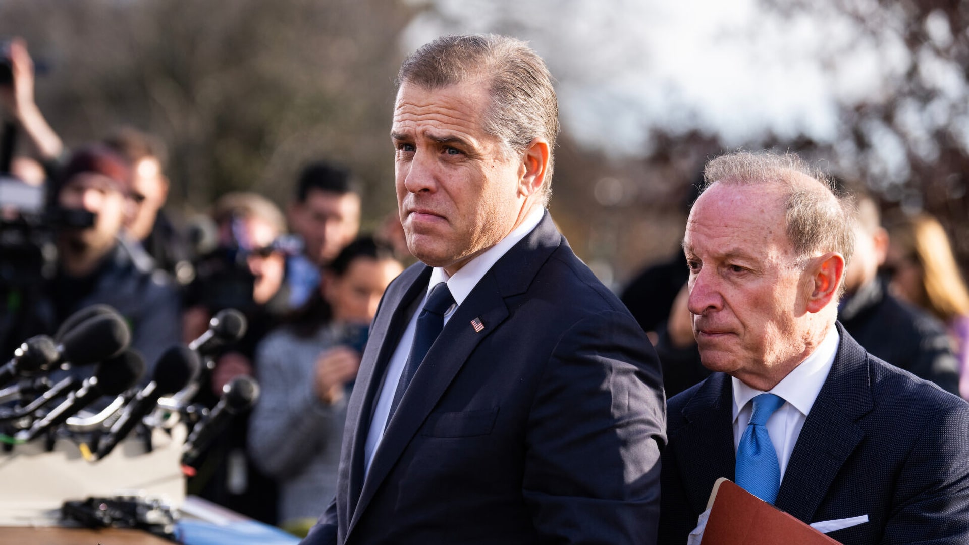 Attorney and businessman Hunter Biden (son of Joseph Biden) on the left, lawyer Abbe Lowell on the right, surrounded by a gaggle of reporters asking about Biden's potential testimony before the House of Representatives about his foreign business dealings Tom Williams/CQ Roll Call, Wiki Commons.